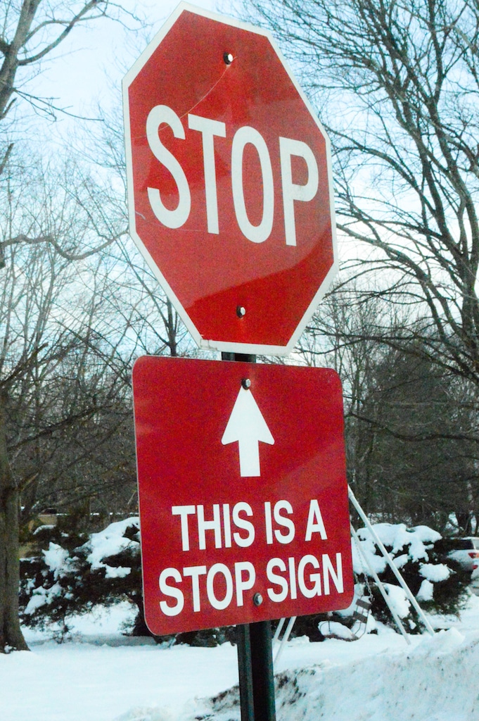 This stop sign has a sign under it to remind you that the above stop sign is a stop sign